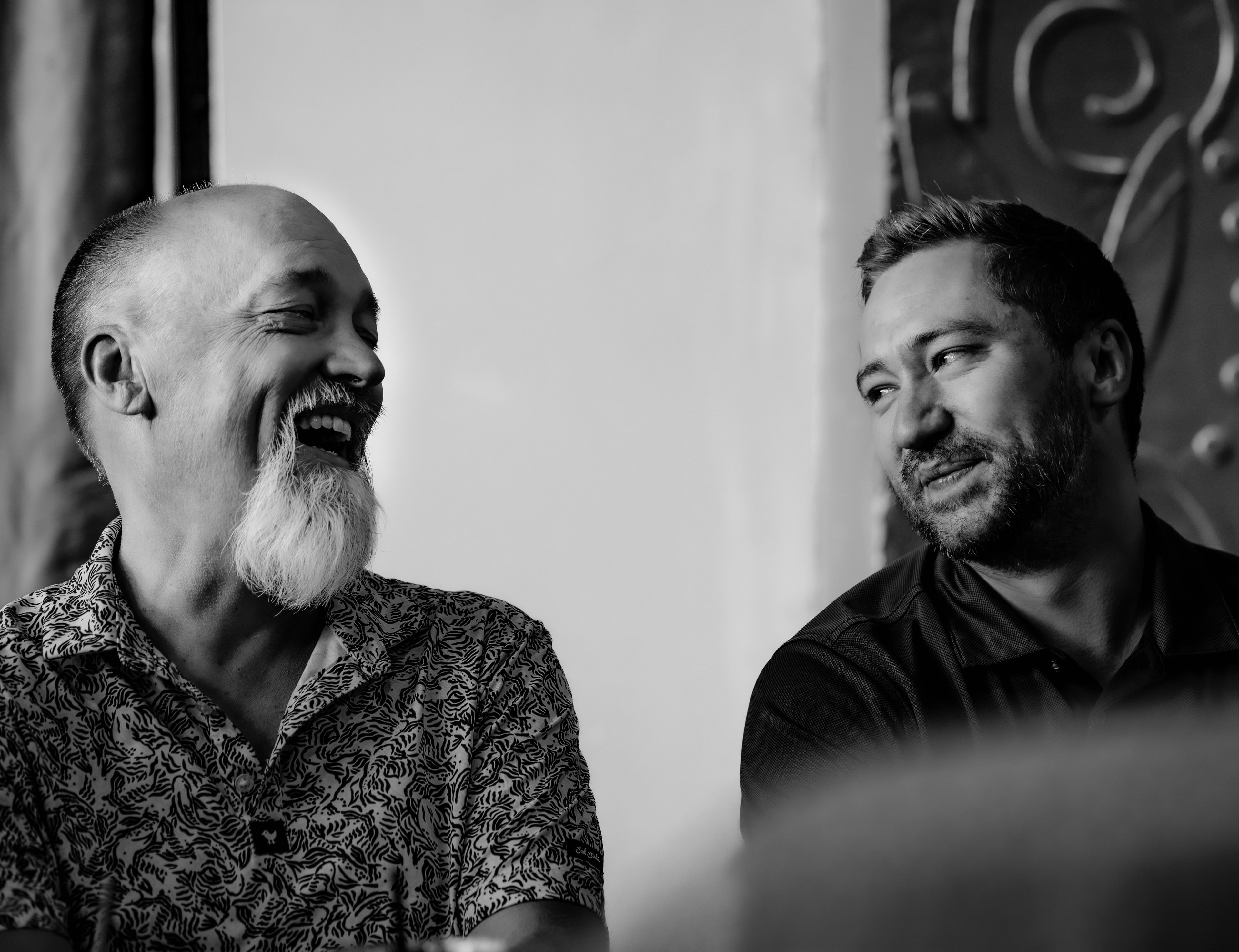 Two members in conversation, black and white portrait